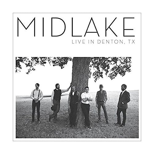 Black and white album cover featuring the band Midlake standing by a large tree.