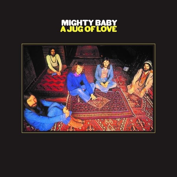 Album cover for Mighty Baby’s “A Jug of Love” featuring a band on a rug.