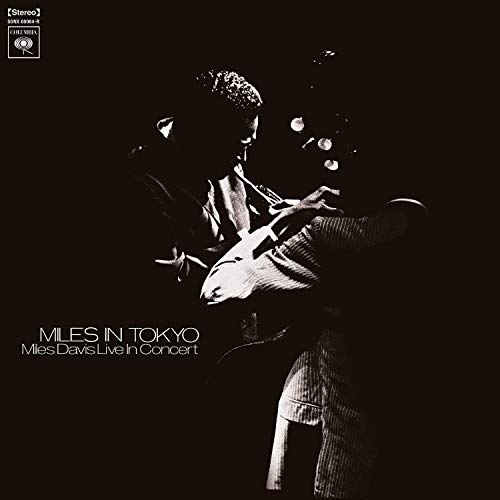 Album cover featuring Miles Davis playing trumpet, with dark background and white text.