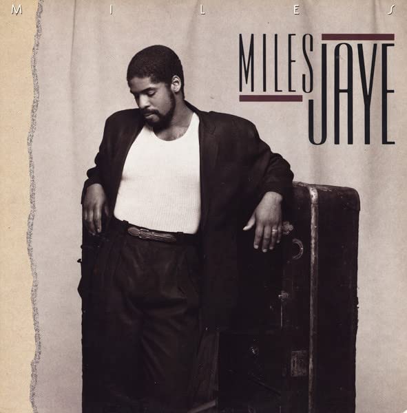 CD cover featuring Miles Jaye, a Black man in a suit, leaning on a trunk.