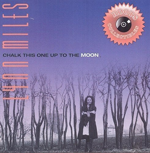 "CD cover featuring a man standing among bare trees under a purple sky."