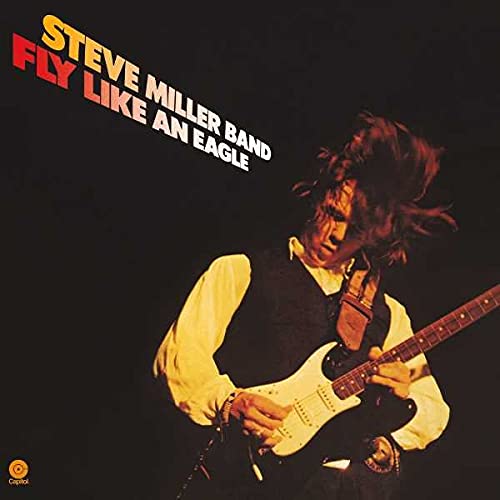 Steve Miller Band album cover featuring a guitarist playing a white guitar.