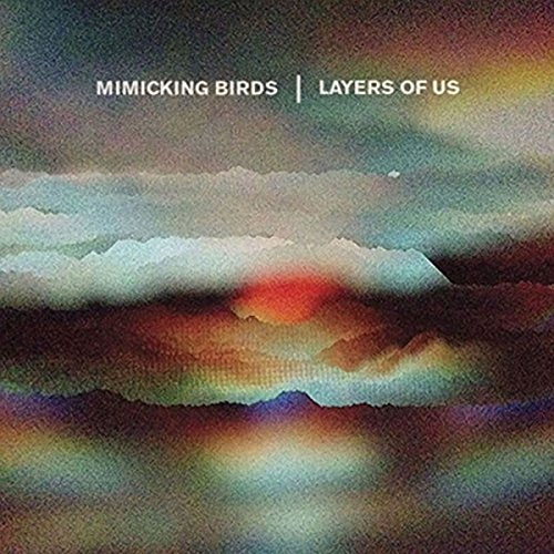 The image depicts a vinyl record cover with a cloudy, multicolored sky. Alt text: Cloudy, multicolored sky with "Mimicking Birds" and "Layers of Us" text overlay.