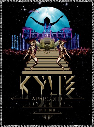 Kylie Minogue concert artwork: stage, fountains, winged figures, and text.