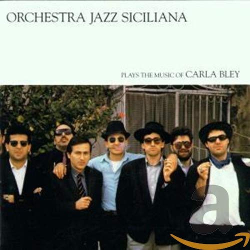 CD cover: six men in hats and sunglasses, leafy background.