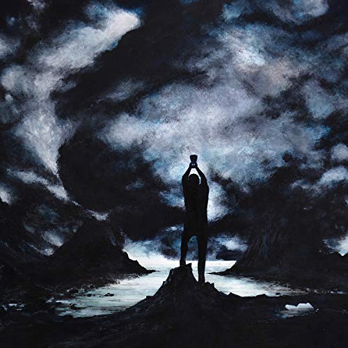 Dark album cover featuring a silhouetted figure raising an object skyward.