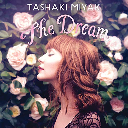 Woman with red hair surrounded by pink roses on album cover "The Dream" by Tashaki Miyaki.
