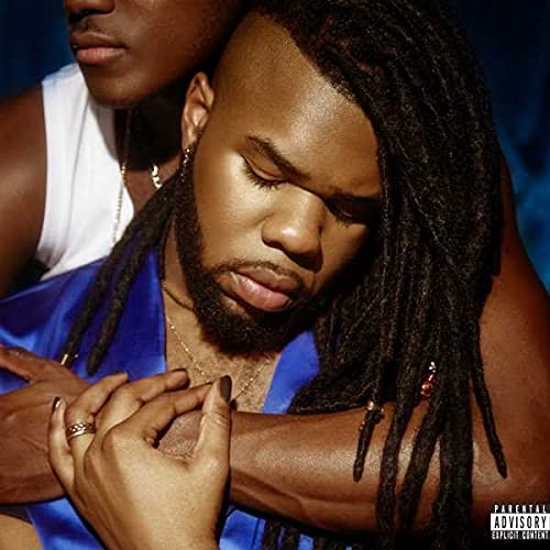CD cover featuring a close-up of Mnek with dreadlocks, embraced by another person.