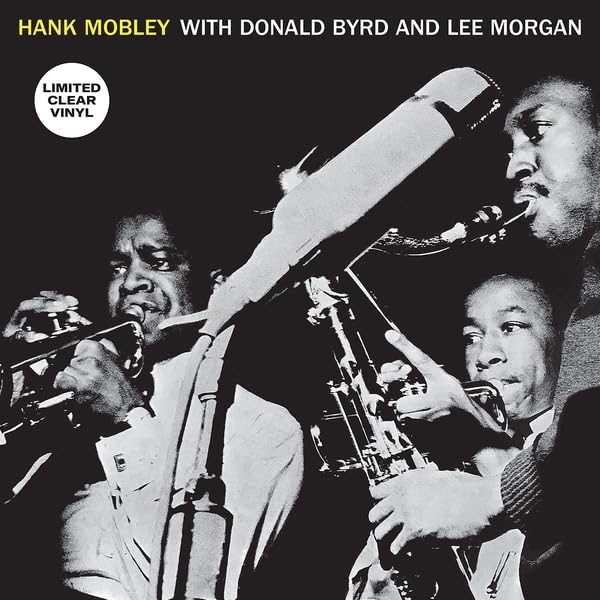 Black and white album cover featuring three jazz musicians playing horns.