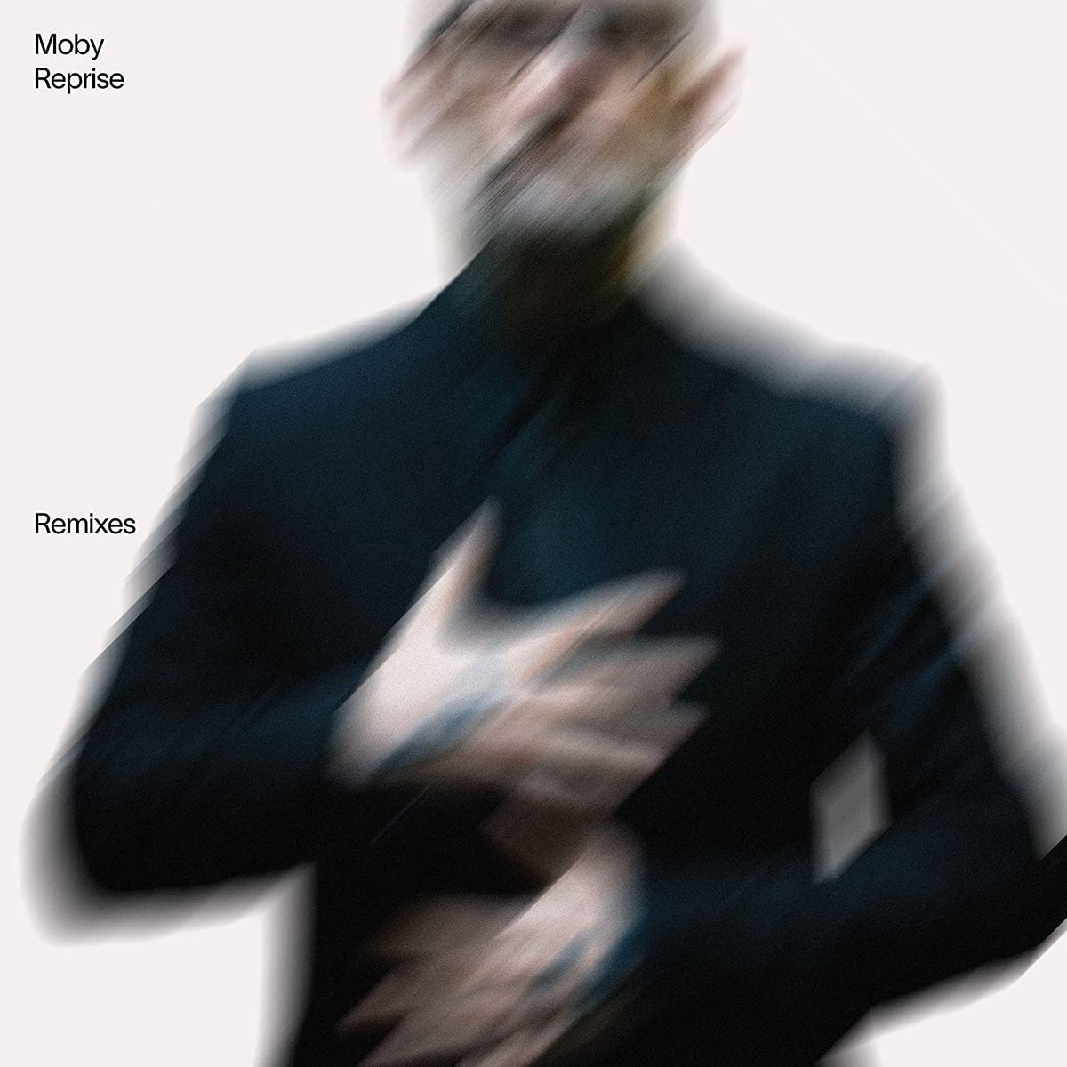 Moby “Reprise - Remixes” CD cover: blurred portrait in dark suit.