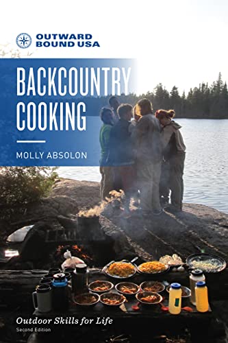 Book cover: “Outward Bound Backcountry Cooking” with people by a lake.