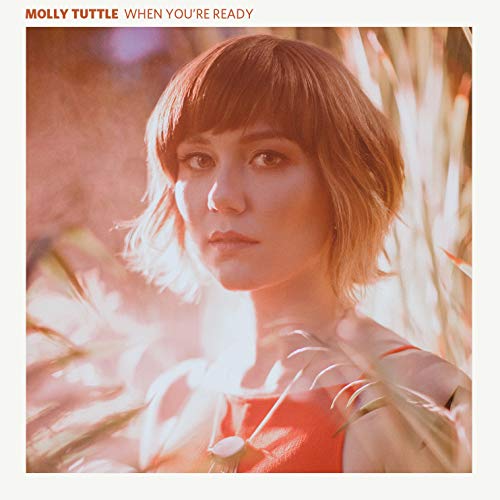 Molly Tuttle album cover featuring a portrait of the artist.