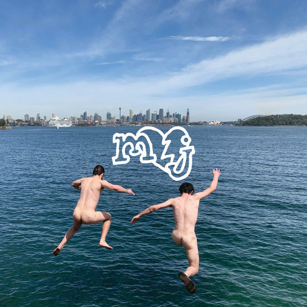 Two nude figures jumping into blue water with a city skyline.