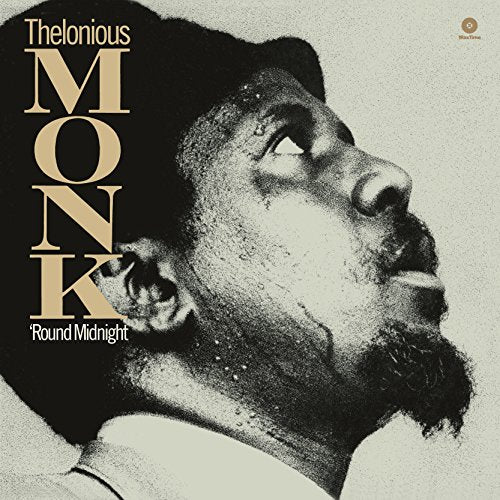 Black and white portrait of Thelonious Monk looking upward on a vinyl record cover.