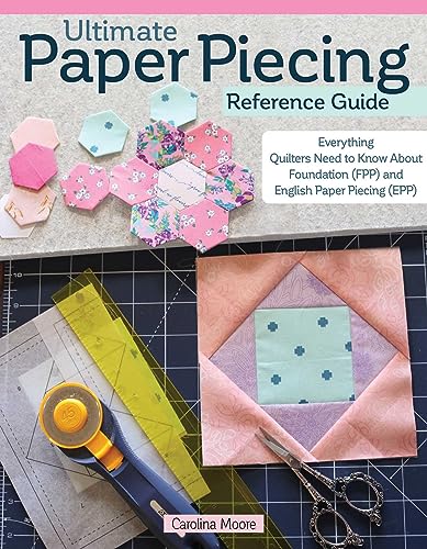 Book cover showing quilting tools, fabric hexagons, and a square block on a mat.