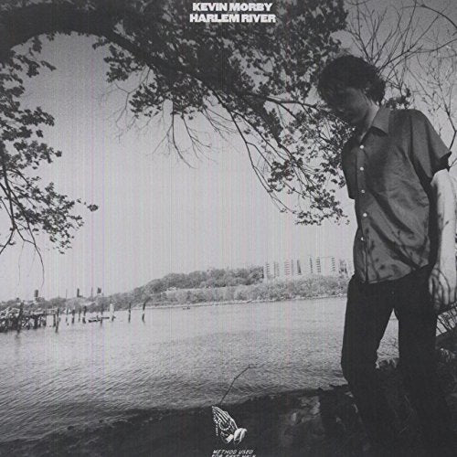 Black and white album cover featuring a man by a river.