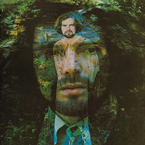 Album cover featuring a man’s face merging with a large, blurred face.