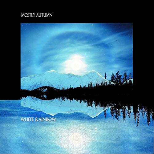 CD cover: snowy mountains and forest reflected in water, blue sky.