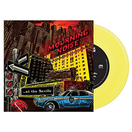 A yellow vinyl record next to its cover art depicting a city street scene.