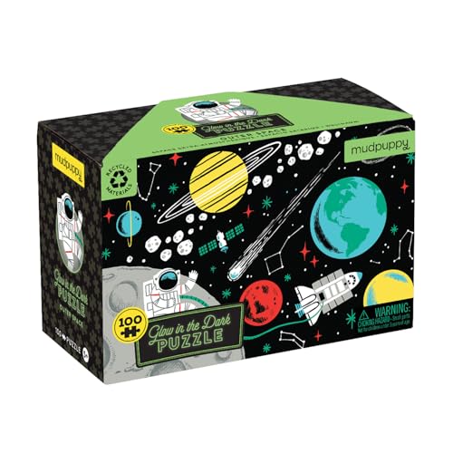 Box for a glow-in-the-dark puzzle depicting planets, astronauts, and rockets.