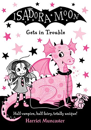 Isadora Moon stands next to a pink dragon and a small stuffed rabbit.