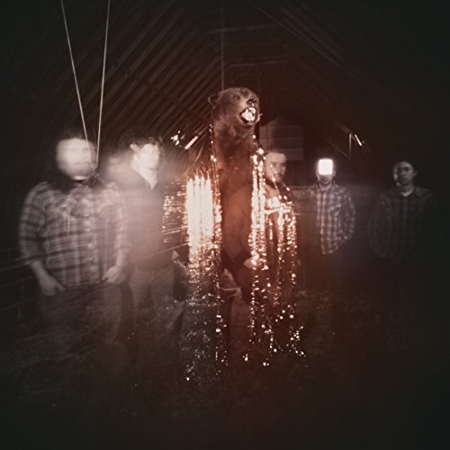 My Morning Jacket album cover: band with a taxidermied bear, dark tones.