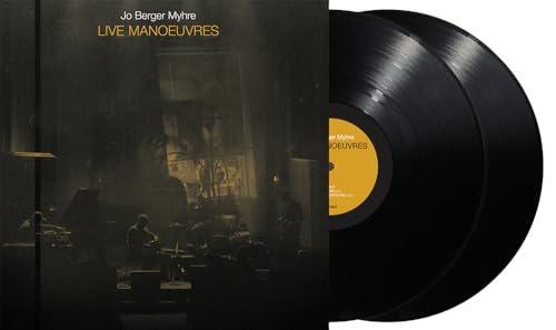 Two black vinyl records next to the album cover for Live Manoeuvres.
