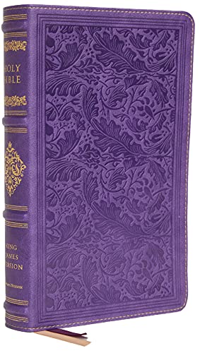 Purple leather-bound Bible with embossed floral design and gilded edges.
