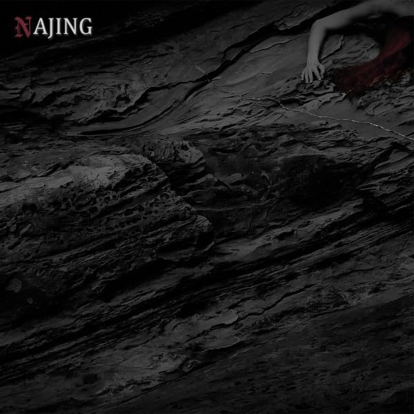 A hand reaching over dark, textured rock with the text Najing in the corner.