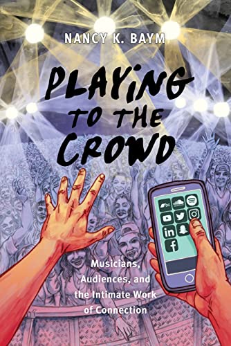 Book cover with stage lights, a crowd, and a hand holding a phone.