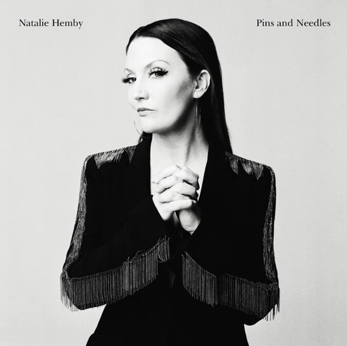 Black and white portrait of Natalie Hemby with hands clasped.