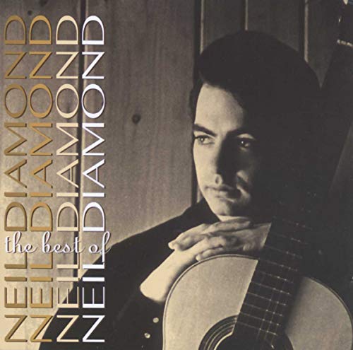 CD cover of Neil Diamond, portrait with guitar, gold lettering.
