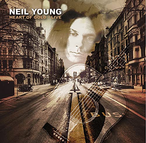 CD case with Neil Young's image, gold accents, and simple typography on the cover.