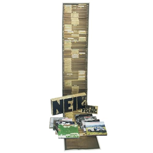 Neil Young Archives Vol. I box set with tall file folder stack and CDs.
