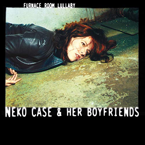 Neko Case album cover: woman lying on a concrete floor.