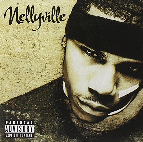 Close-up portrait of Nelly wearing a headband on a textured beige background.