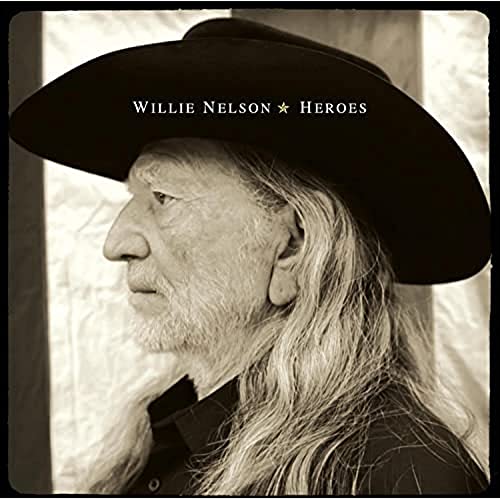 Willie Nelson in a black cowboy hat, grayscale portrait, album cover.