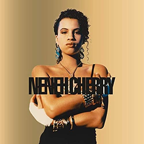 Neneh Cherry album cover, portrait of a woman with jewelry and text.