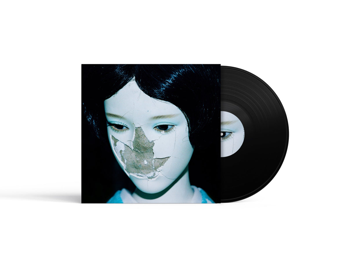 Vinyl record with album cover featuring a portrait of a young woman.