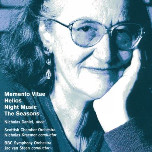 Cover of "Helios / Memen" CD featuring a woman in glasses with text overlay.