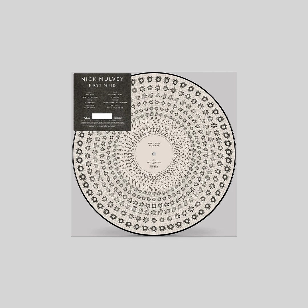 Vinyl record of Nick Mulvey’s “First Mind” with circular patterned sleeve.