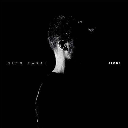 Black and white album cover with a man facing right against a dark background.