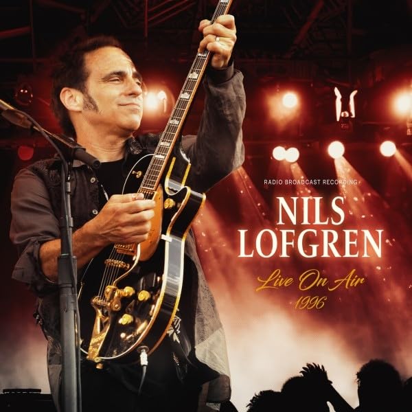 Nils Lofgren playing a guitar on stage with bright stage lights.