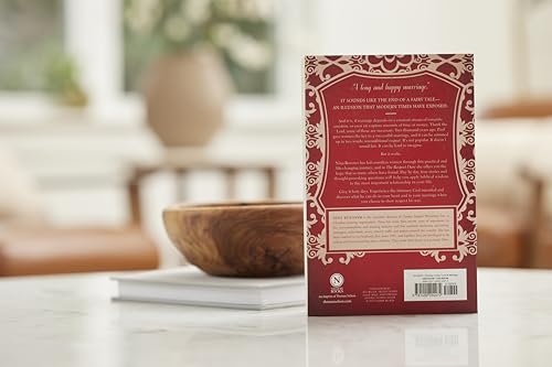 Book cover with red and white ornate design, resting on a table.