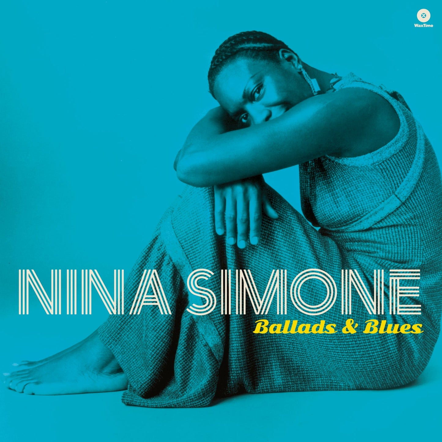 Nina Simone sitting in a teal-toned album cover for Ballads and Blues.