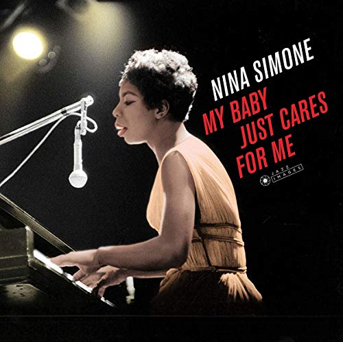 Nina Simone at a piano with a microphone, album cover art.