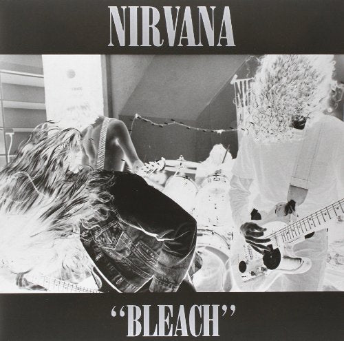 Black and white album cover for Nirvana’s “Bleach” with band members performing.