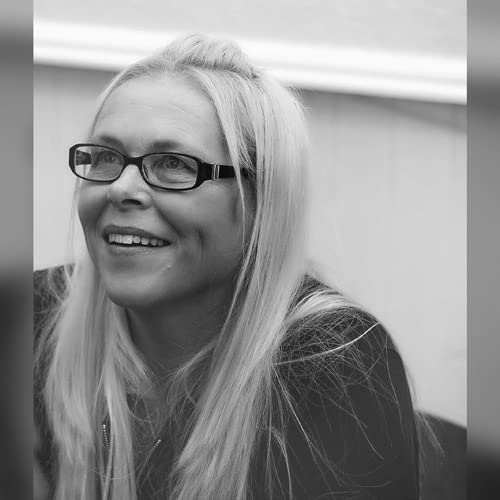Black and white portrait of a smiling woman with long blonde hair.