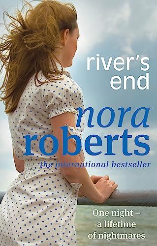 Book cover: woman in blue dress looking out at the sea.