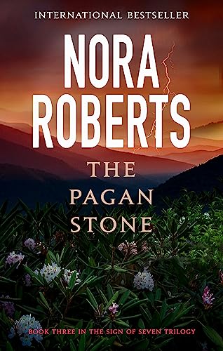 Book cover: “The Pagan Stone” by Nora Roberts, with stormy sky and foliage.